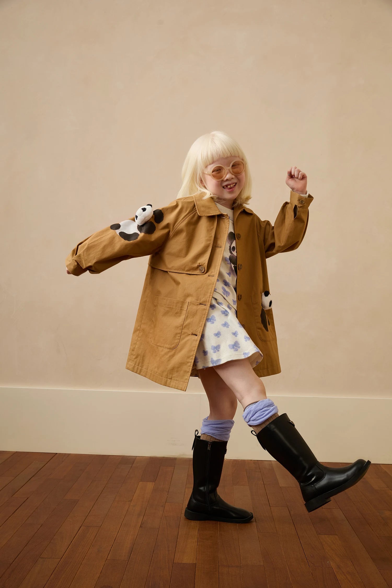 D14: panda trench coat over blue panda layered tee and matching printed skort, with blue colour-block socks