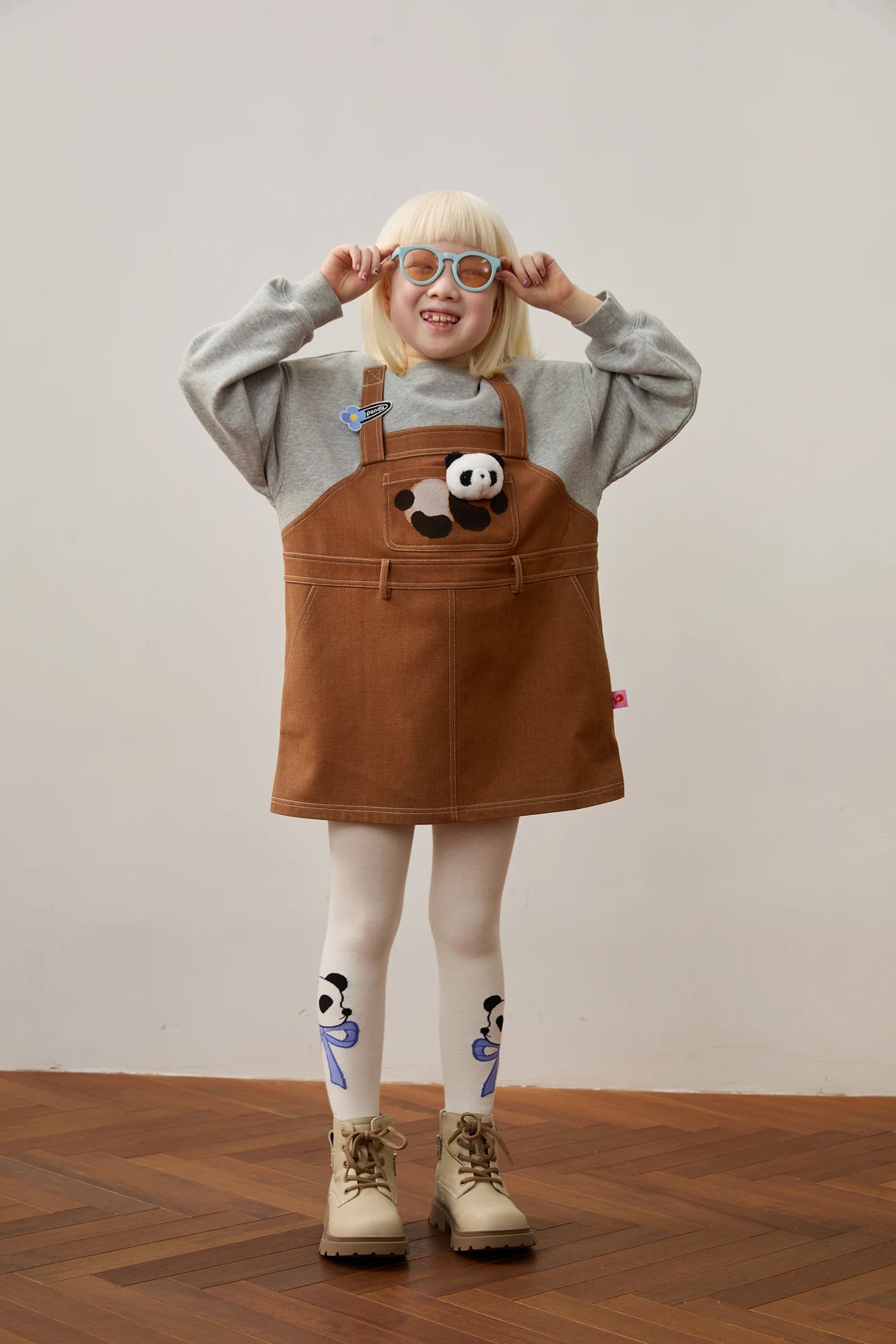 Panda sweatshirt dress with blue panda jacquard tights; full styled look