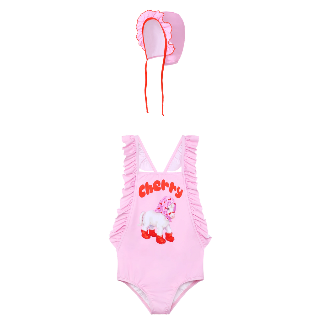 Cherry Pony Ruffle Swimsuit with matching swim cap flat lay by Poco Blush