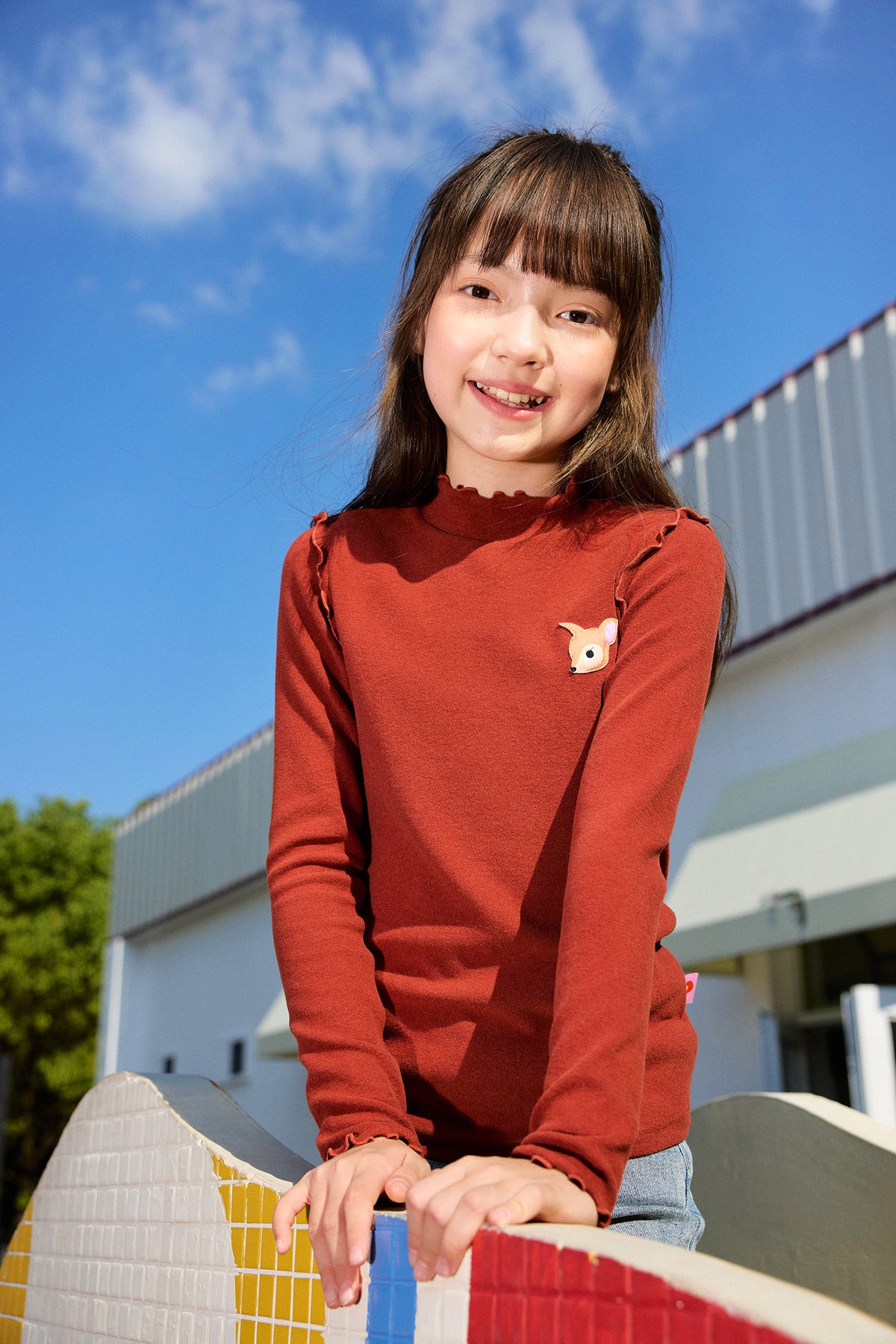 Ink-Wash Frill-Neck Base-Layer Top — Brick Red; worn view; other styled garments and accessories are not included