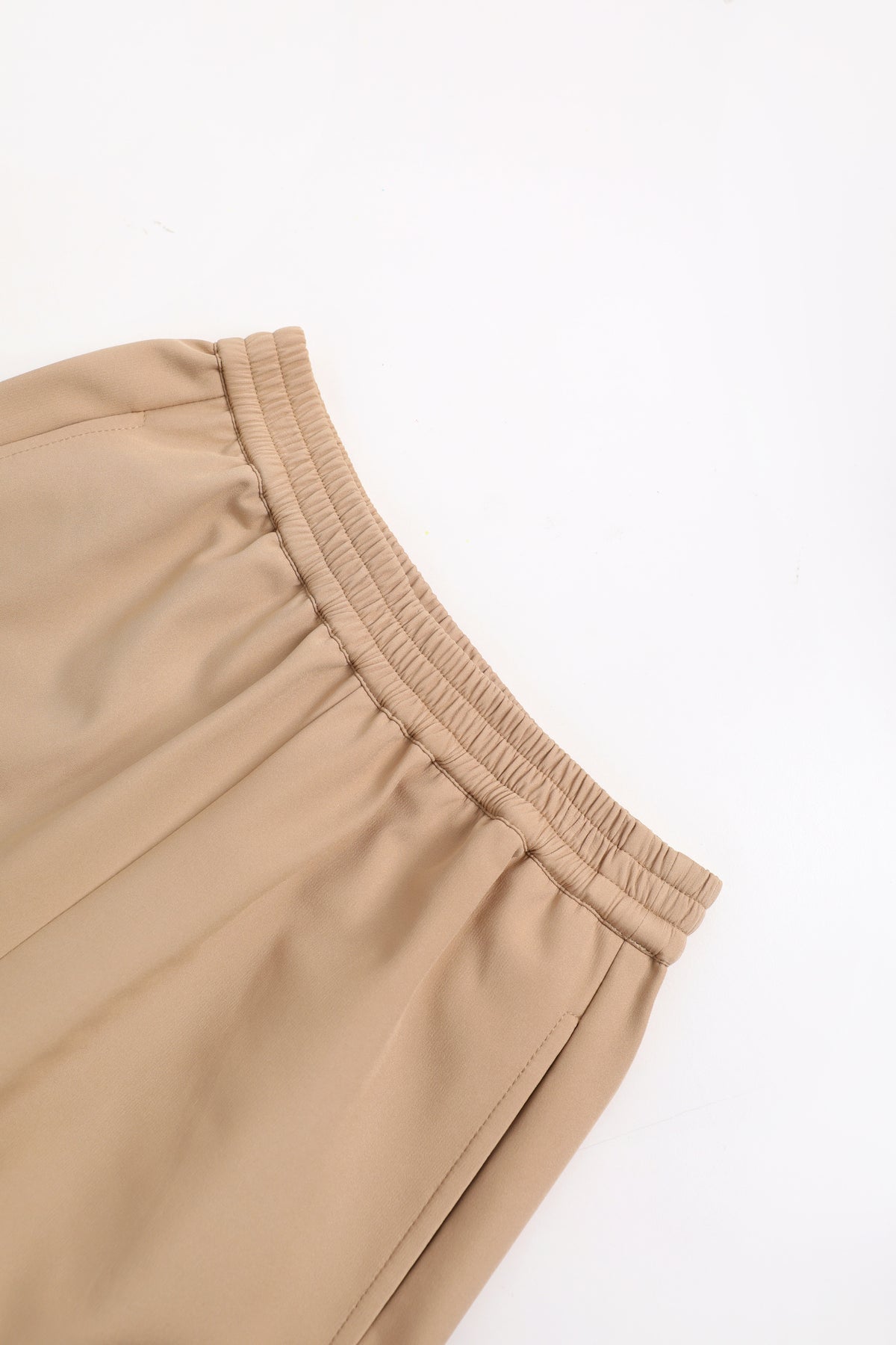 Ink-Wash Fleece-Backed Trousers — Soft Ochre; construction and decoration detail