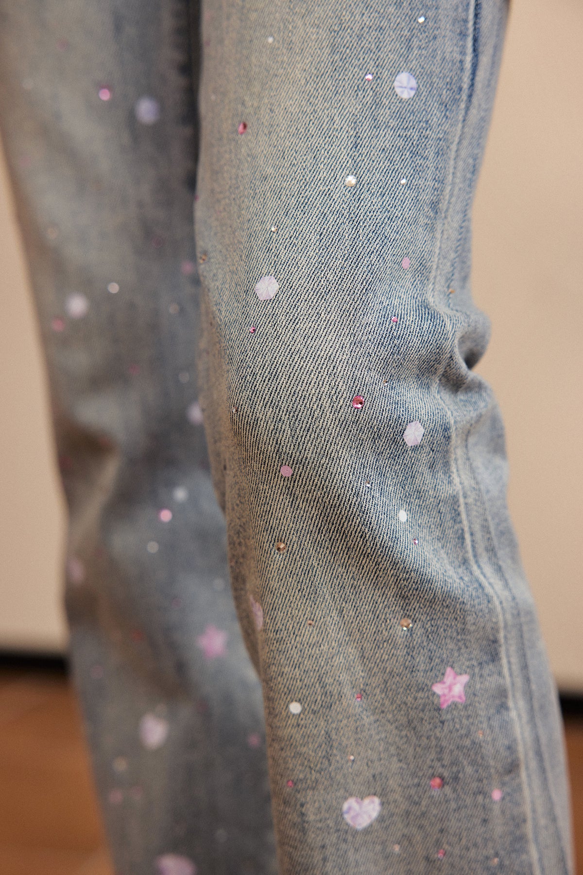 Crystal-Print Flared Jeans — Denim Blue; worn view; other styled garments and accessories are not included