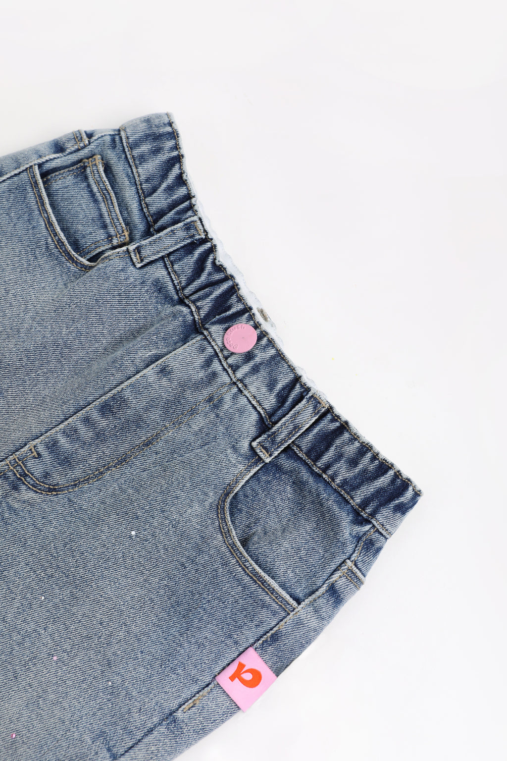 Crystal-Print Flared Jeans — Denim Blue; construction and decoration detail