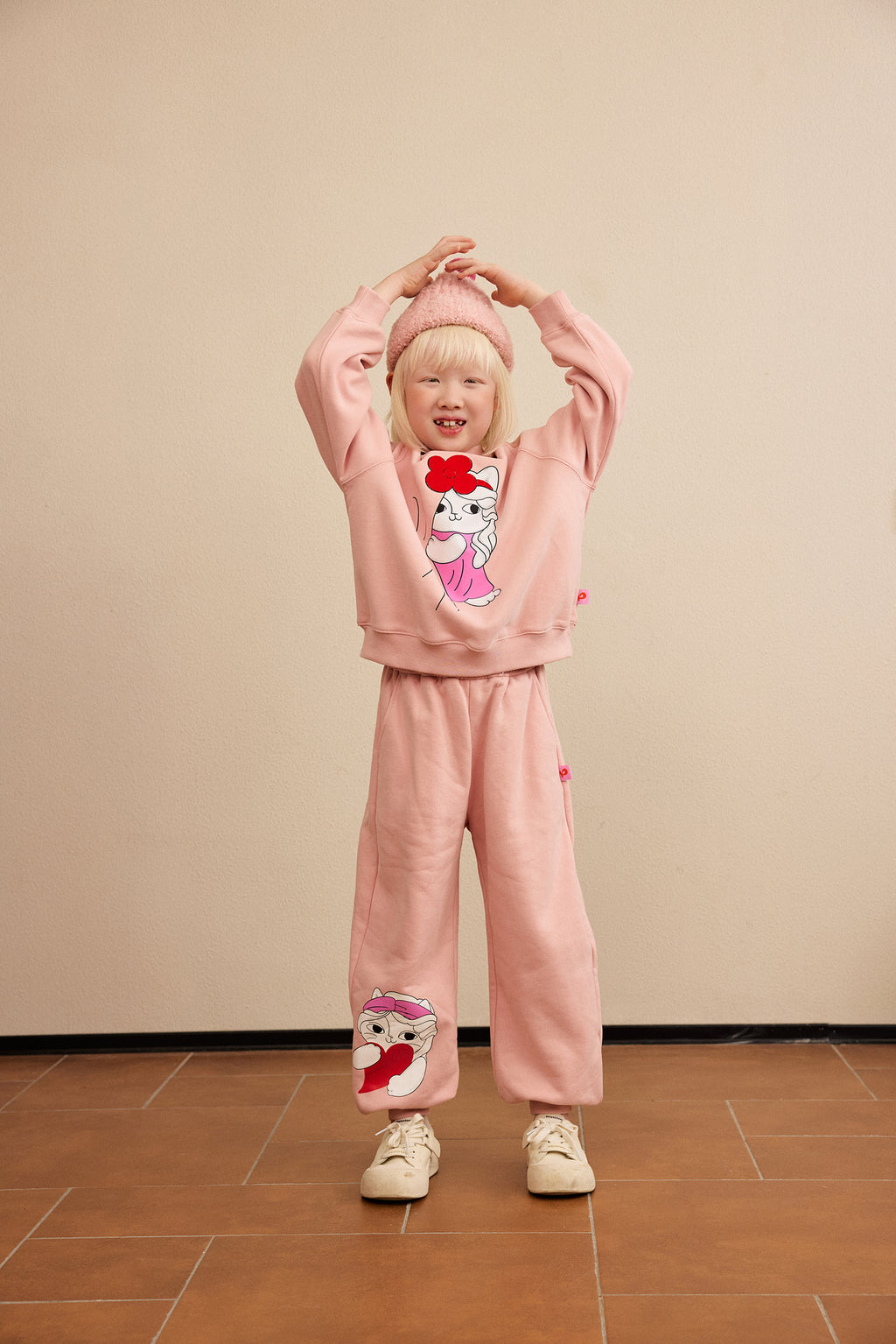 Hide-and-Seek Cat Joggers — Dusty Pink; worn view; other styled garments and accessories are not included