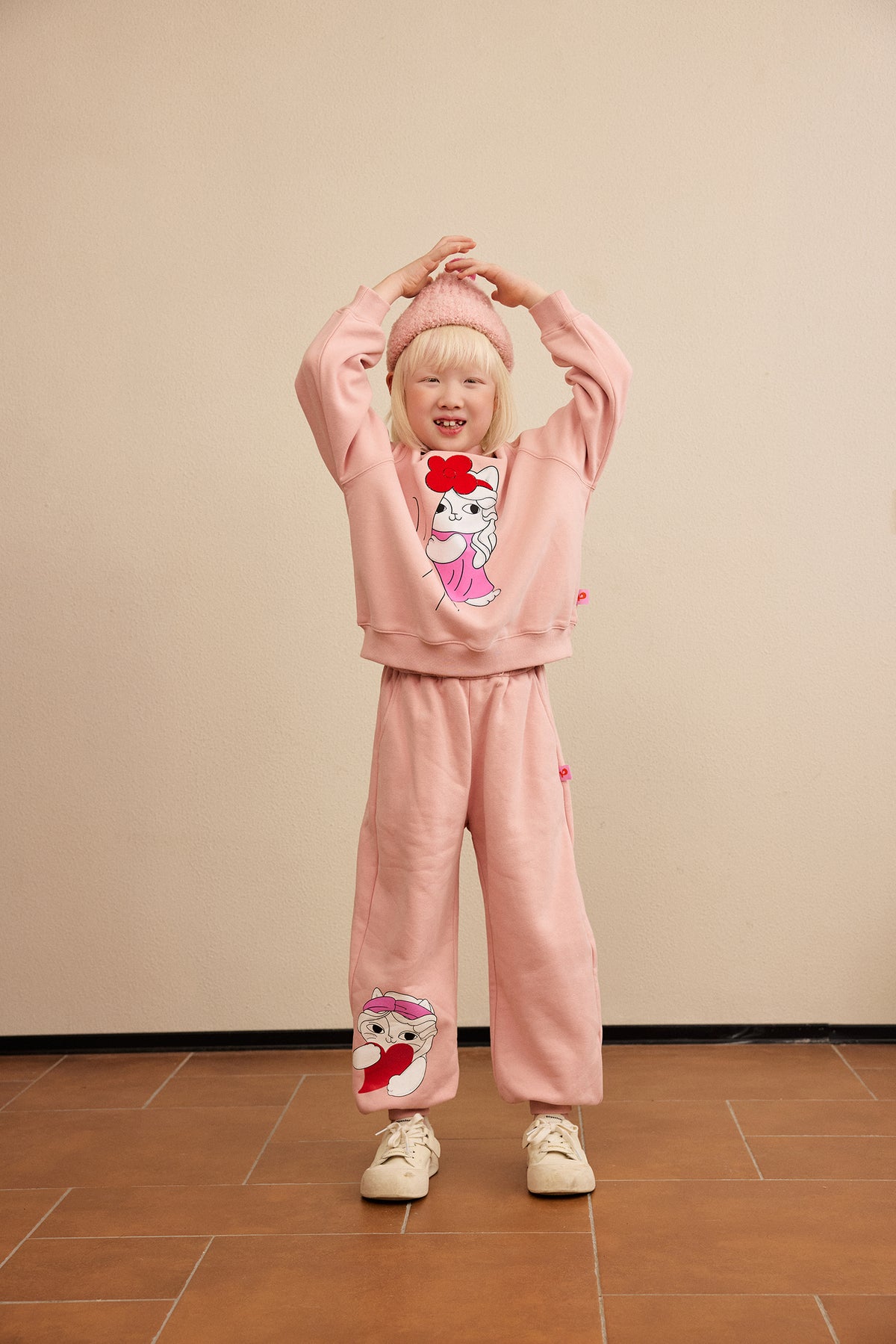 Hide-and-Seek Cat Joggers — Dusty Pink; worn view; other styled garments and accessories are not included