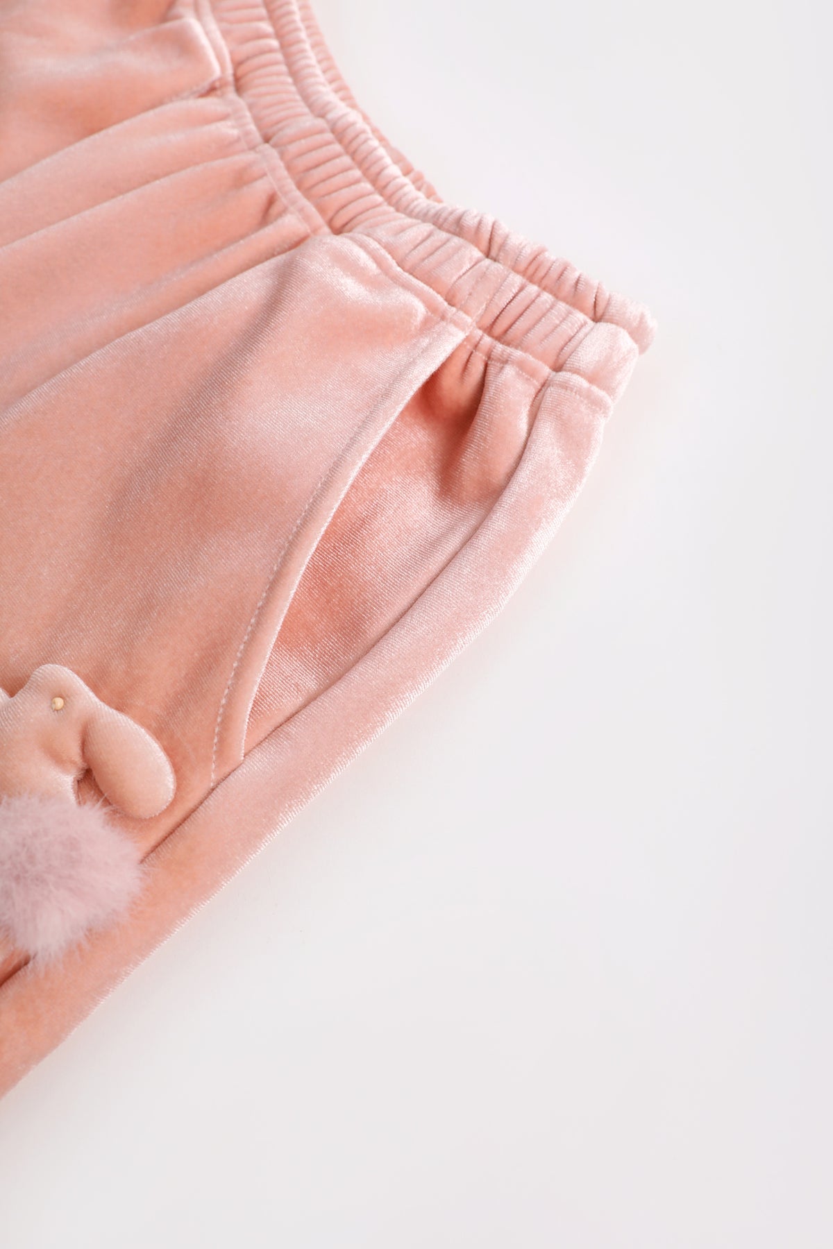 Moon Rabbit Velvet Trousers — Dusty Pink; construction and decoration detail