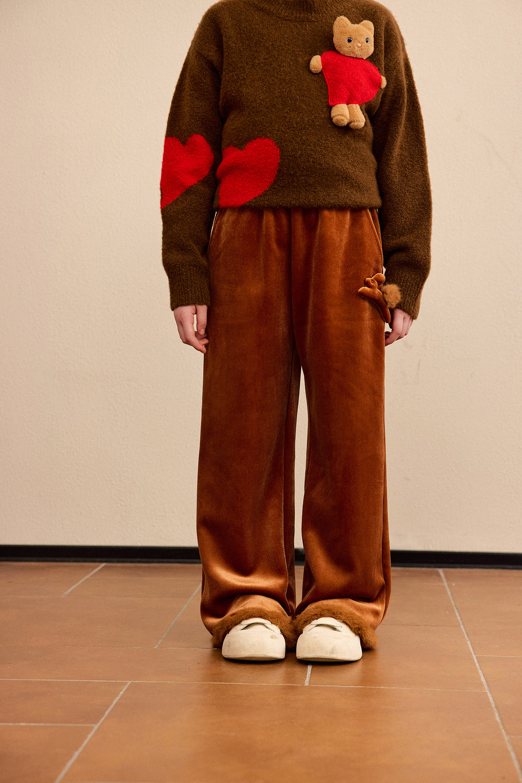 Moon Rabbit Velvet Trousers — Caramel Brown; worn view; other styled garments and accessories are not included