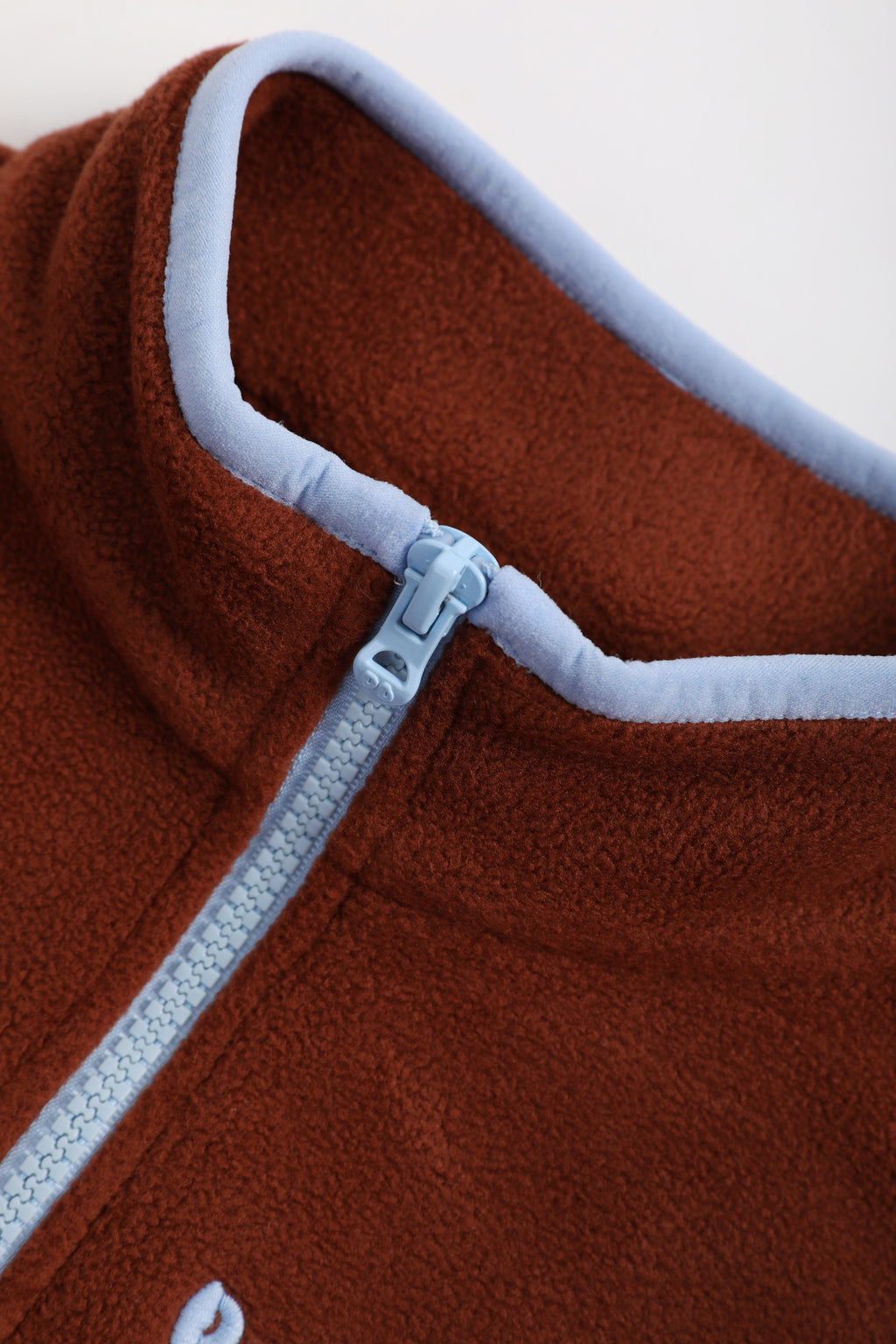 Ink-Wash Animal-Pocket Fleece Pinafore — Caramel Brown; construction and decoration detail