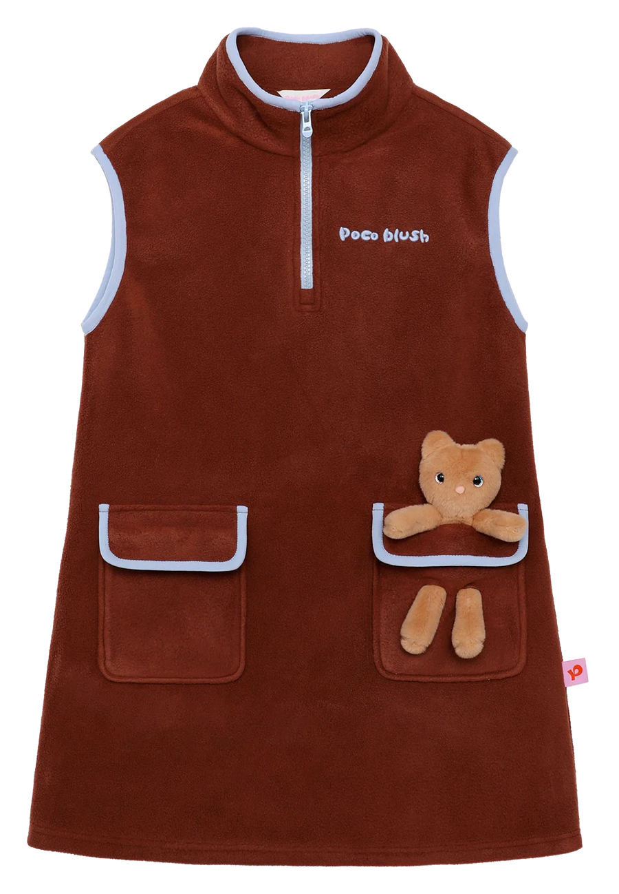 Caramel Brown fleece pinafore with a little animal peeking out of the pocket.