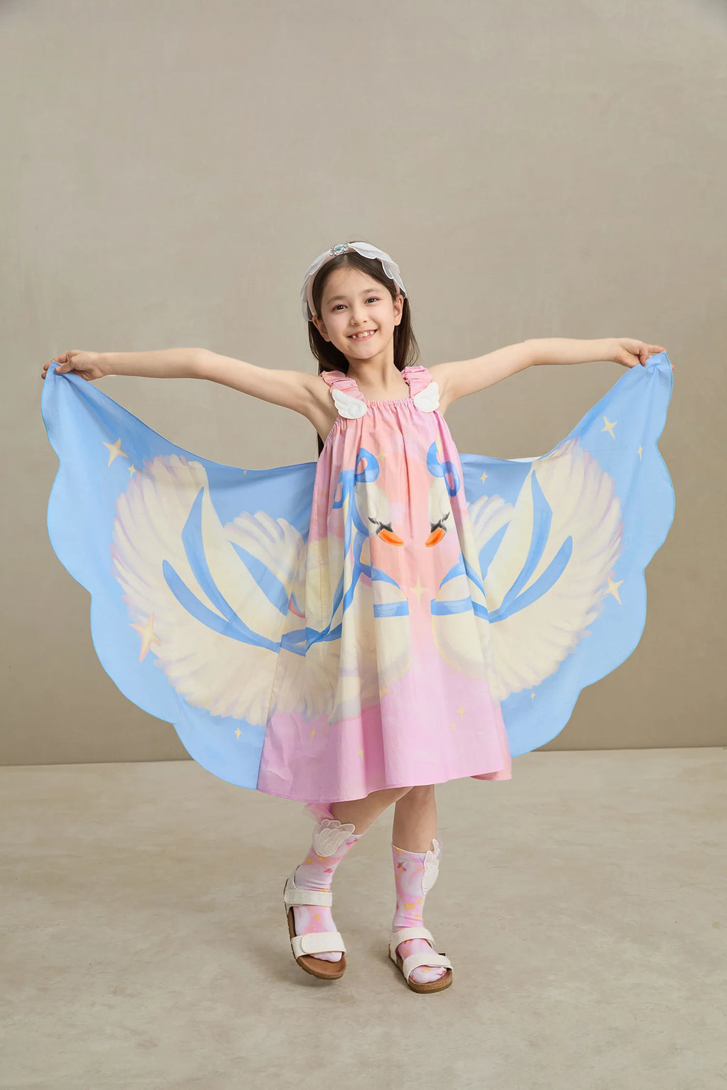 Poco Blush Swan Wing Art Print Dress — playful kids clothing for girls