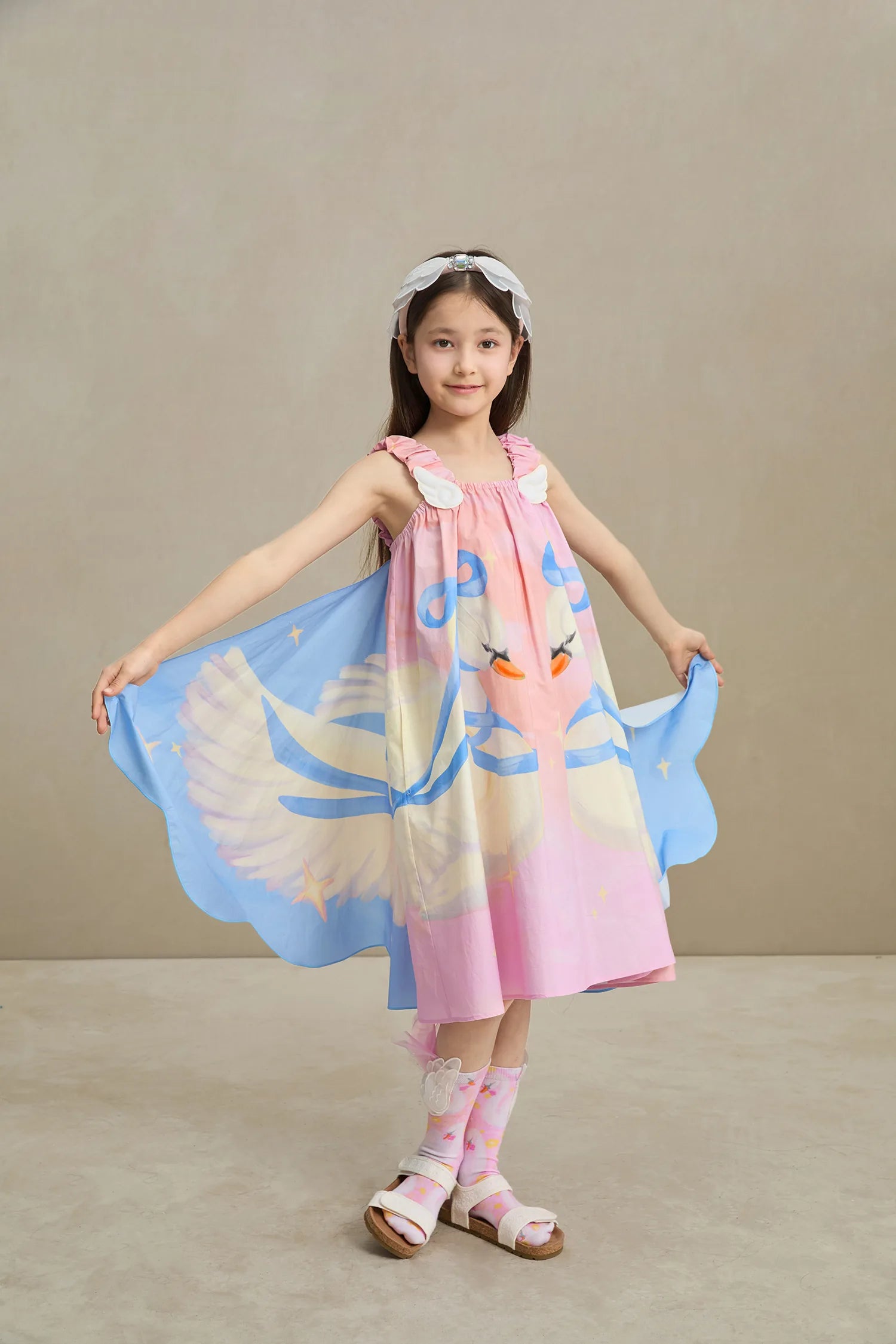 Poco Blush Swan Wing Art Print Dress — playful kids clothing for girls